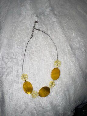 Yellow flower and bead necklace